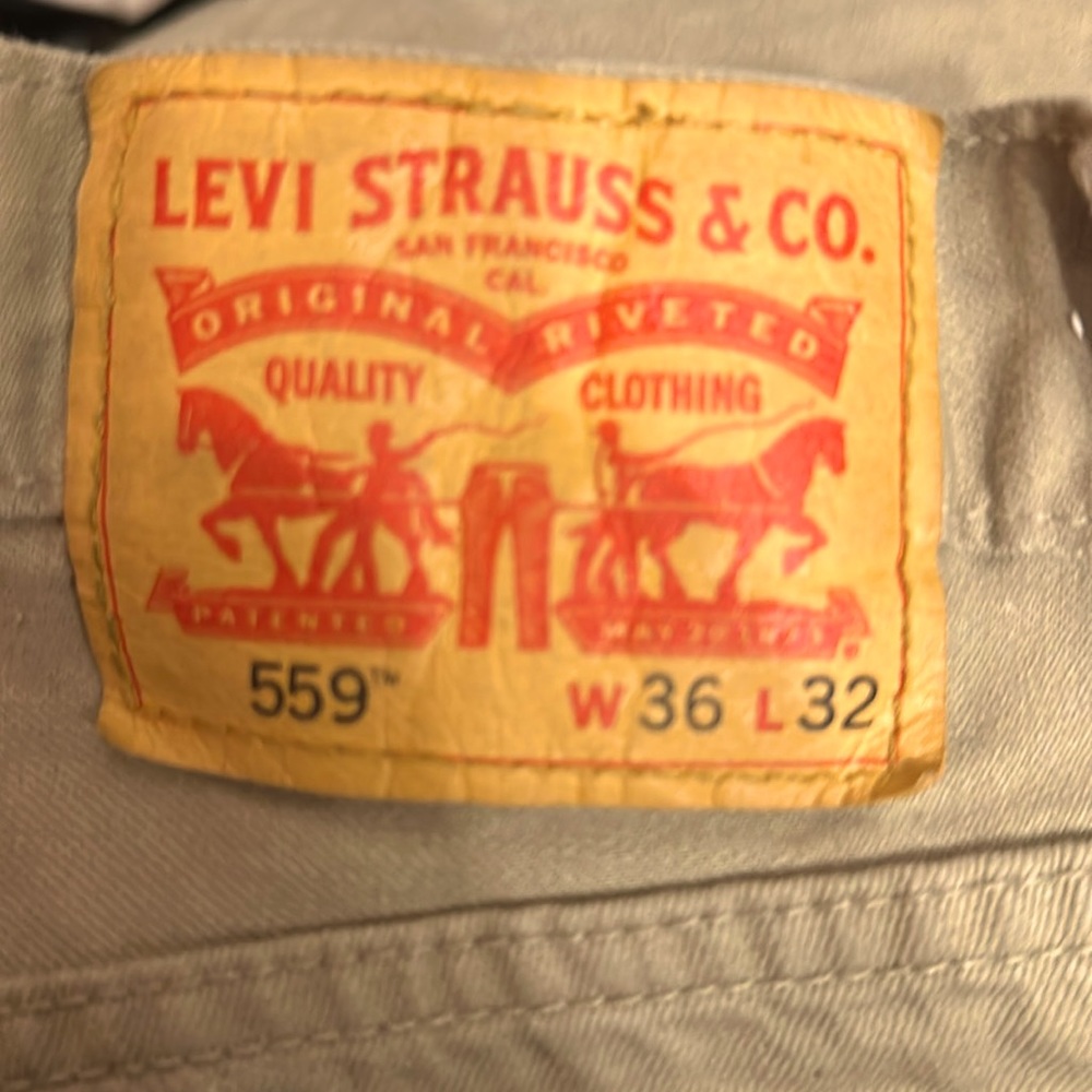 Men’s Levi khaki jeans size 36/32 two small ink stains on left knee
